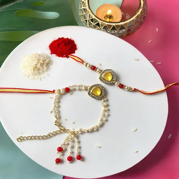 Elegant_Bhaiya_Bhabhi_Lumba_&_Pearl_Rakhi_With_Roli_Chawal_&_Card