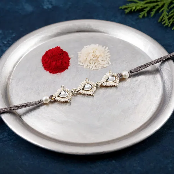 Delicate_Pearl_Beads_Grey_Rakhi_with_Roli_Chawal_&_Rakshabandhan_Card