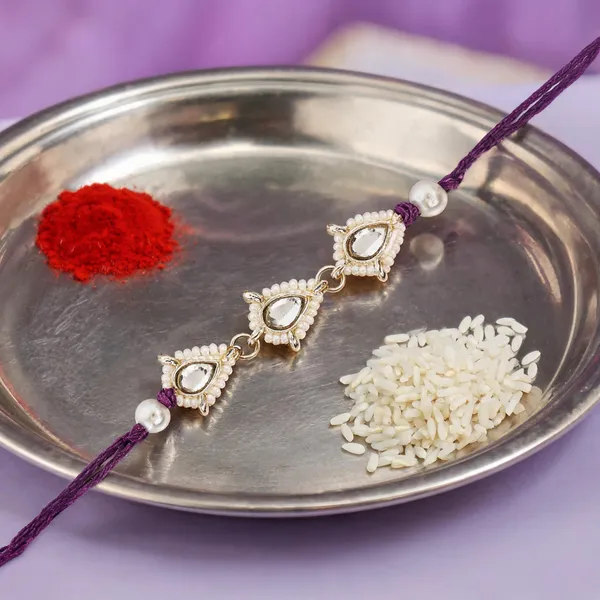 Delicate_Pearl_Beads_Wine_Rakhi_with_Roli_Chawal_&_Rakshabandhan_Card