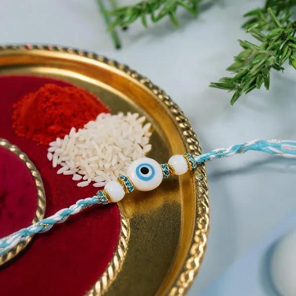 Blue_And_White_Thread_Beaded_Rakhi_For_Raksha_Bandhan_For_Brother