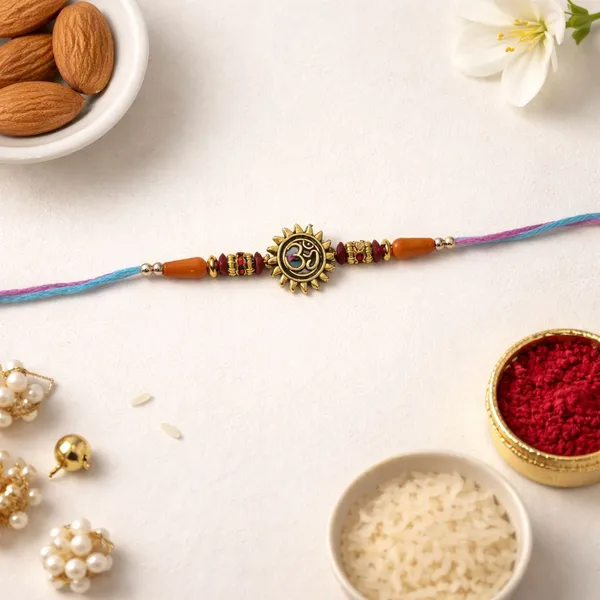 Traditional_Om_Sun_Shape_Rakhi_with_Roli_Chawal_&_Rakshabandhan_Card