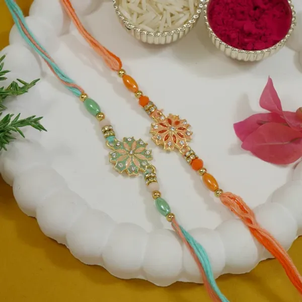 Enamel_Designer_Rakhi_Combo_for_Bhai_-_Mint_&_Orange_Thread_with_Roli_Chawal