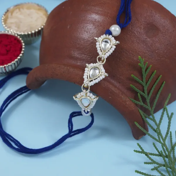 Delicate_Pearl_Beads_Blue_Rakhi_with_Roli_Chawal_&_Rakshabandhan_Card