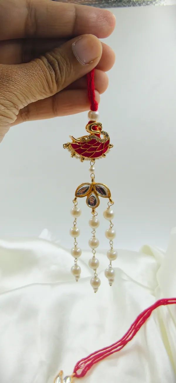 Red_Thread_Gold_Tone_Bird_Motif_Pearl_Drop_Rakhi