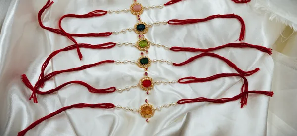 Multicolor_Pearl_Beaded_Gold_Tone_Rakhi_Set