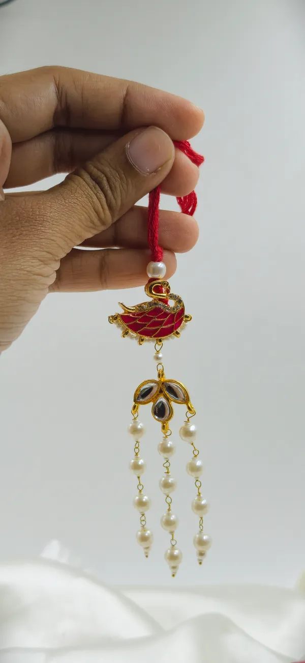 Red_Thread_Gold_Tone_Bird_Motif_Pearl_Drop_Rakhi