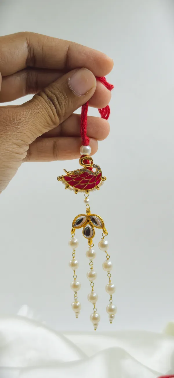 Red_Thread_Gold_Tone_Bird_Motif_Pearl_Drop_Rakhi