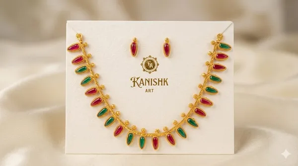 GOLD_COLORED_LEAF_NECKLACE_AND_EARRING_SET