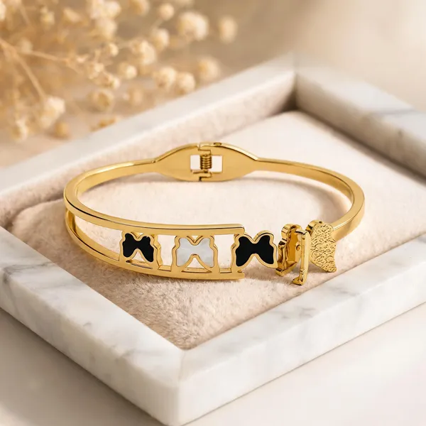 Gold_Toned_Black_And_White_Bow_Charm_Bangle_Bracelet_For_Women