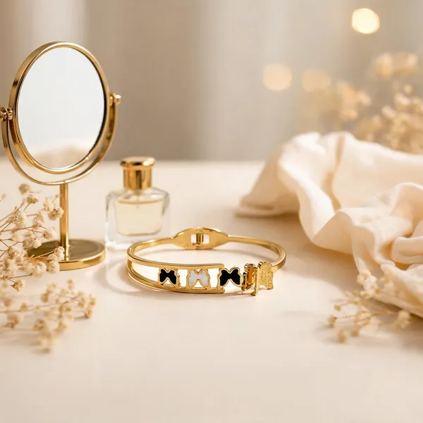 Gold_Toned_Black_And_White_Bow_Charm_Bangle_Bracelet_For_Women