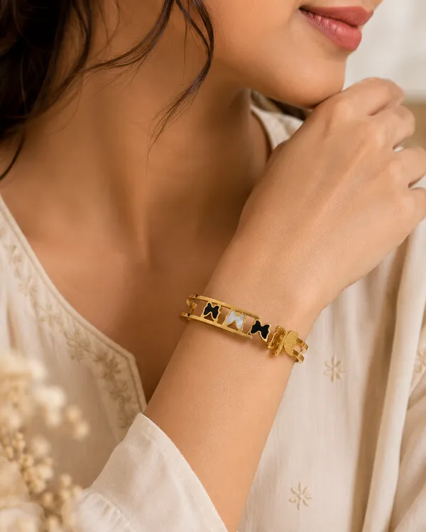 Gold_Toned_Black_And_White_Bow_Charm_Bangle_Bracelet_For_Women