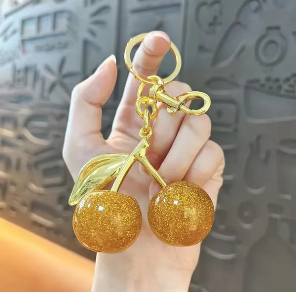 Orange_And_Golden_Stainless_Steel_Gold_Plated_18_Carat_Keychain_For_Women