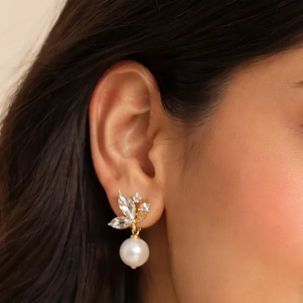 Floral/leaf-inspired_arrangement_with_three_clear,_faceted_crystal_stones_on_each_earring