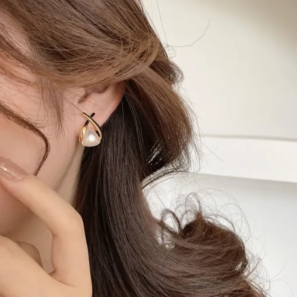 crossed,_flowing_gold-tone_frame_Korean_Earing_For_Women
