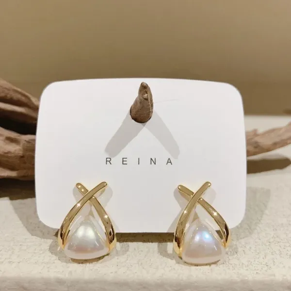 crossed,_flowing_gold-tone_frame_Korean_Earing_For_Women