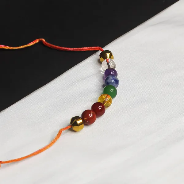 Seven_Chakra_Crystal_Rakhi_With_Golden_Hematite_Damru_Charm_For_Balance,_Protection,_&_Energy_Healing