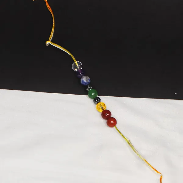 Seven_Chakra_Crystal_Rakhi_With_Silver_Hematite_Damru_Charm_For_Balance,_Protection,_&_Energy_Healing