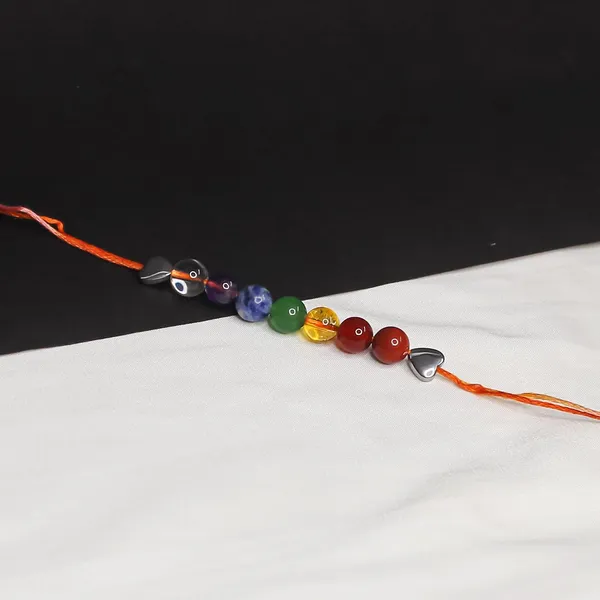 Seven_Chakra_Crystal_Rakhi_With_Silver_Hematite_Heart_Charm_For_Balance,_Protection,_&_Energy_Healing