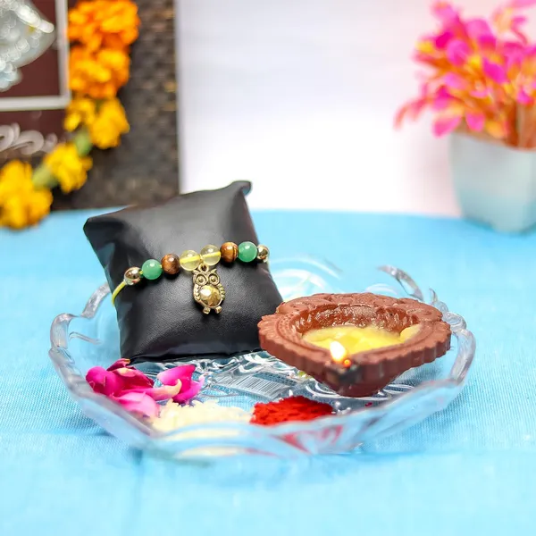 Money_Magnet_Crystal_Rakhi_With_Hanging_Golden_Owl_Charm_Powerful_Wealth-Attracting_Accessory,_Perfect_Raksha_Bandhan_Gift