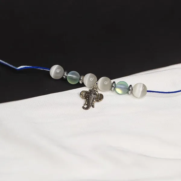 Elegant_Crystal_Rakhi_For_Brother_–_Symbol_Of_Peace,_Love_&_Emotional_Healing_|_Handmade_Spiritual_Raksha_Bandhan_Gift