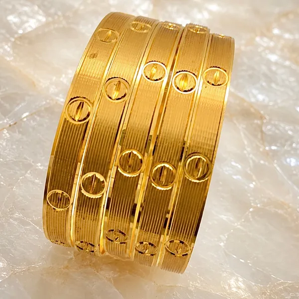 Gold_Micro_Plated_Ribbed_Screw_Motif_Bangle_For_Women