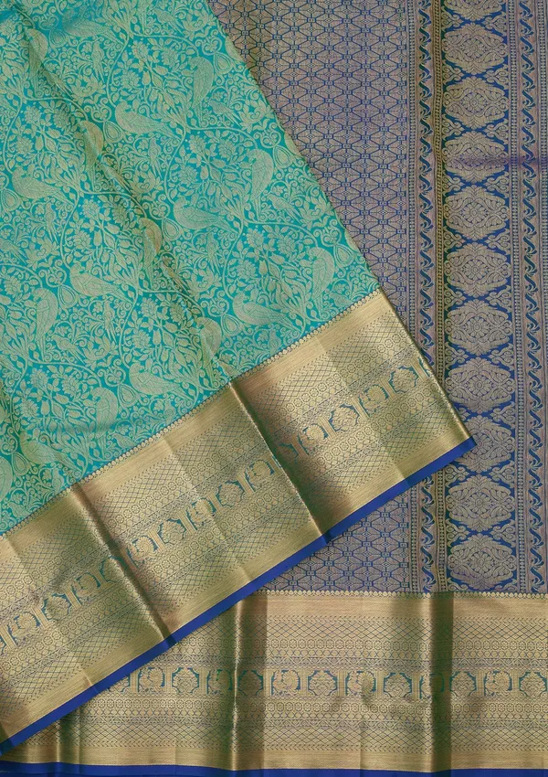 Turquoise_Blue_Silk_Jaal_Saree_With_Matching_Blouse_Piece