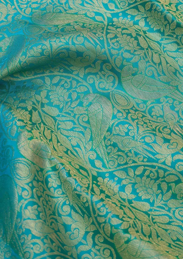 Turquoise_Blue_Silk_Jaal_Saree_With_Matching_Blouse_Piece
