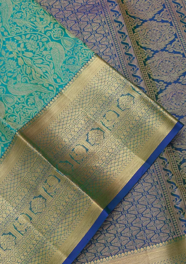 Turquoise_Blue_Silk_Jaal_Saree_With_Matching_Blouse_Piece