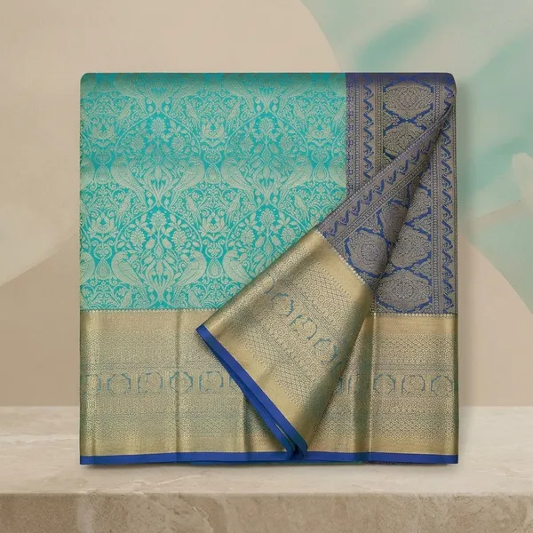 Turquoise_Blue_Silk_Jaal_Saree_With_Matching_Blouse_Piece