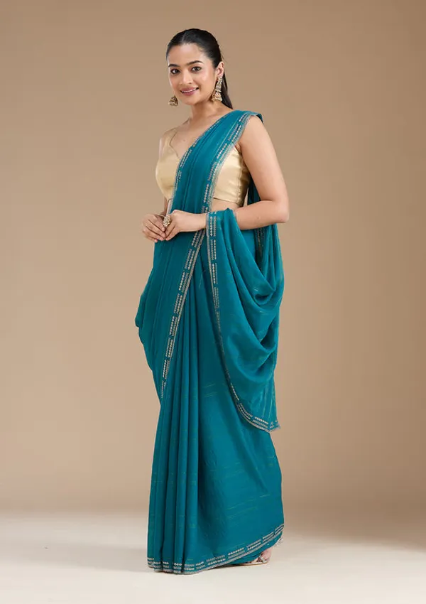 Peacock_Blue_Chiffon_Gold_Stonework_Saree_With_Matching_Blouse_Piece
