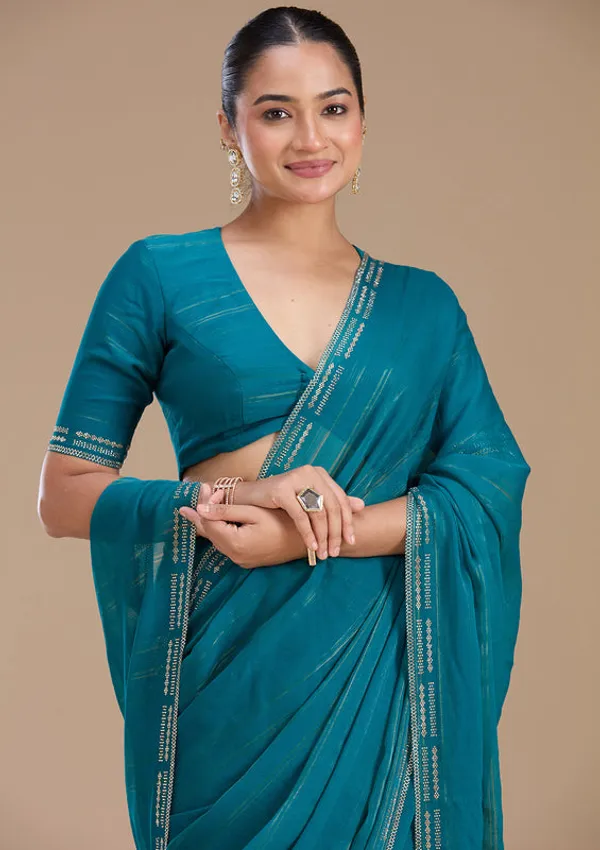Peacock_Blue_Chiffon_Gold_Stonework_Saree_With_Matching_Blouse_Piece