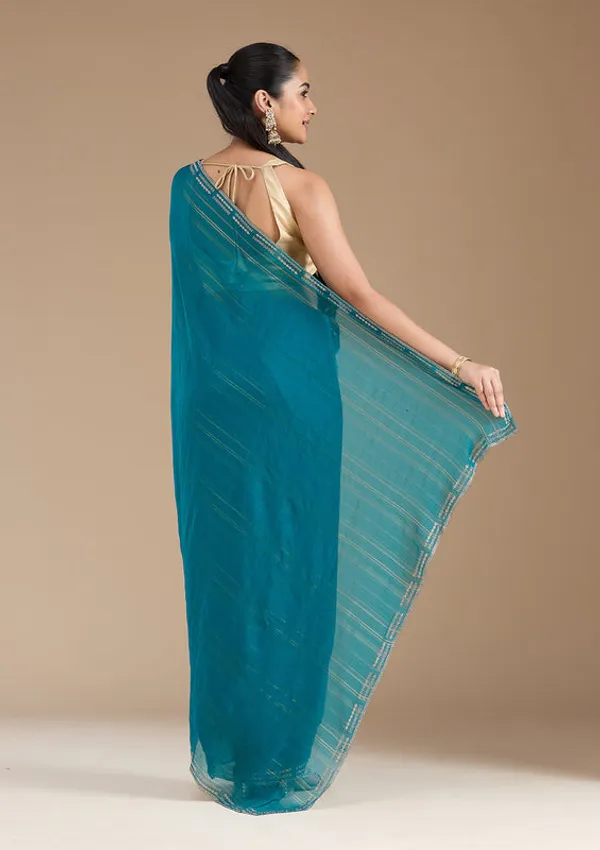 Peacock_Blue_Chiffon_Gold_Stonework_Saree_With_Matching_Blouse_Piece