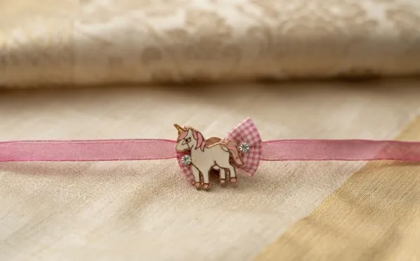 Pink_Ribbon_Unicorn_Charm_Rakhi_For_Kids