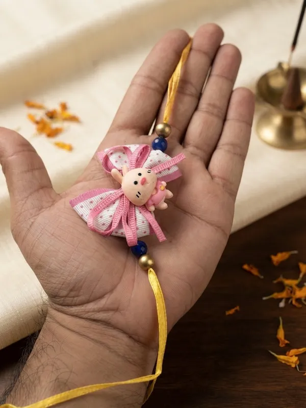 Pink_And_Yellow_Ribbon_Doll_Rakhi_for_Kids