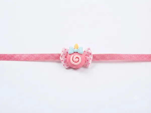 Pink_Ribbon_Candy_Bow_Rakhi_for_Kids