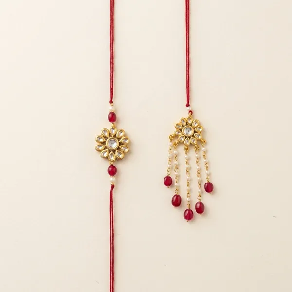 Gold_And_Red_Kundan_Brass_Floral_Rakhi_And_Lumba_Set_For_Couple