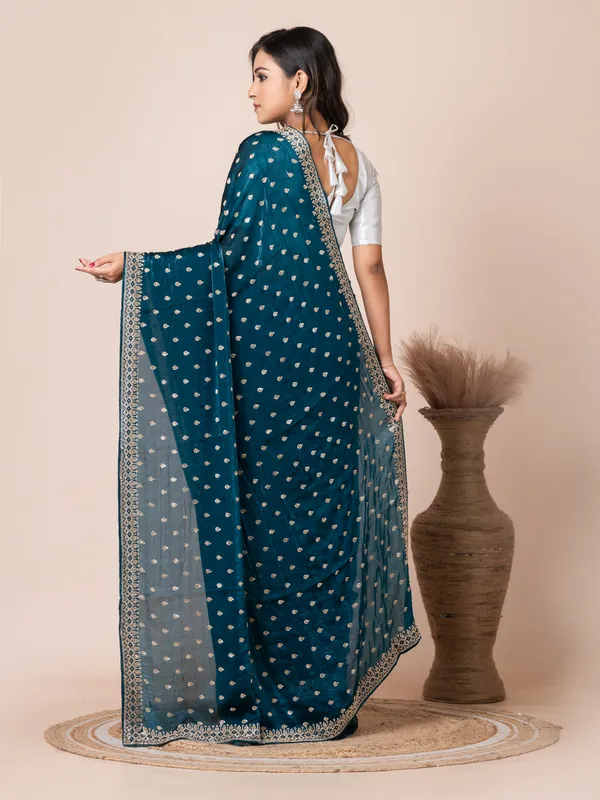 Sophisticated_Teal_Malmal_Silk_Saree_with_Embroidered_Border