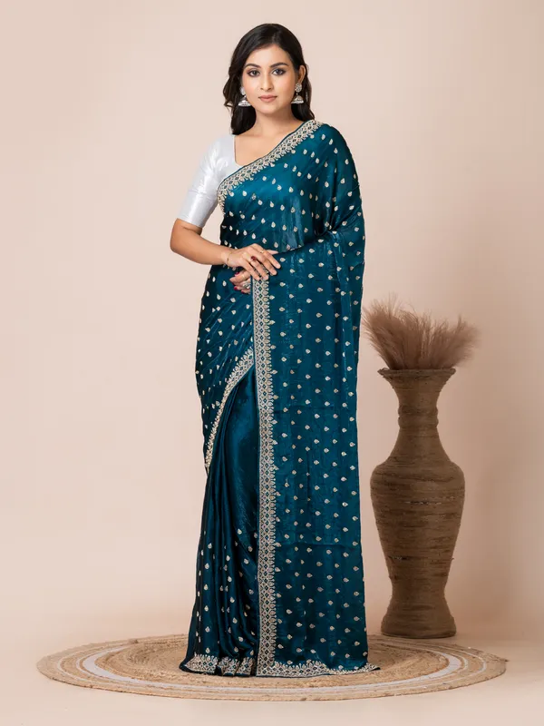Sophisticated_Teal_Malmal_Silk_Saree_with_Embroidered_Border
