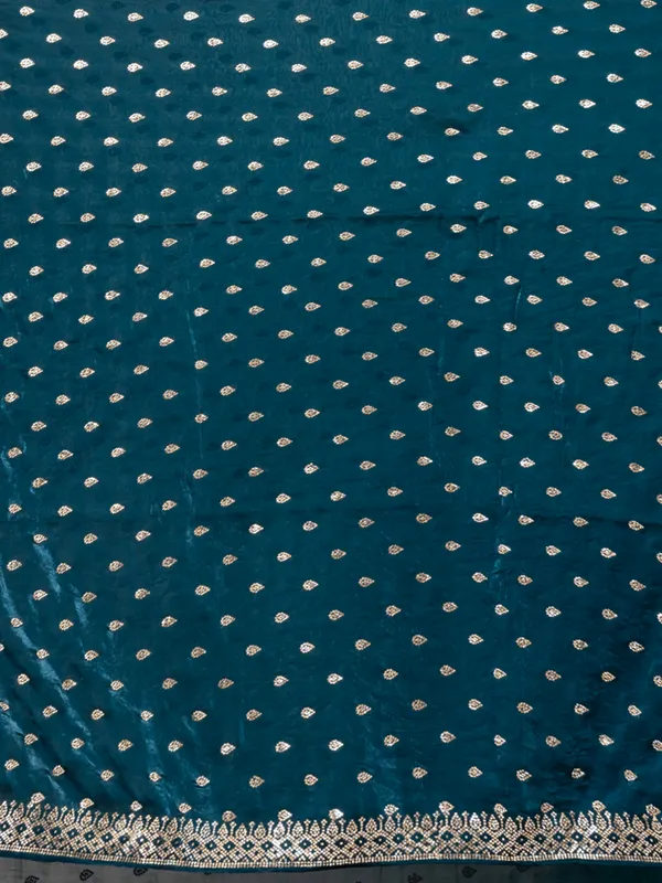 Sophisticated_Teal_Malmal_Silk_Saree_with_Embroidered_Border