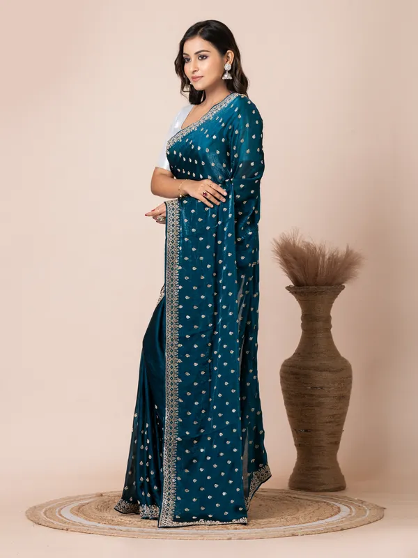 Sophisticated_Teal_Malmal_Silk_Saree_with_Embroidered_Border