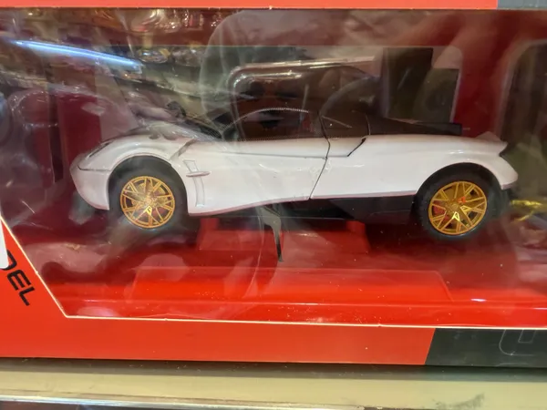 White_Sports_Car_Toy_With_Gold_Wheels