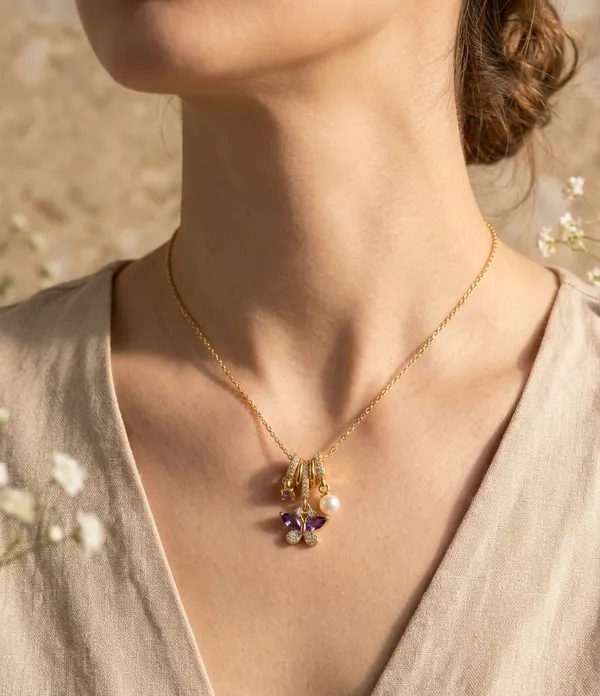Titli_Charm_Necklace_–_Anti-Tarnish_Gold_Tone_Chain_With_Butterfly,_Pearl_&_Pave_Charms