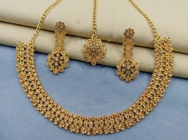 Golden_Alloy_Traditional_Floral_Necklace_Earrings_Maang_Tikka_Set_For_Women