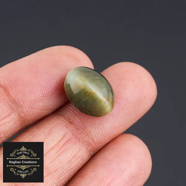 Cat's_eye_Gemstone_weight_-_6.91_Carat_Certificate_Number:-208509