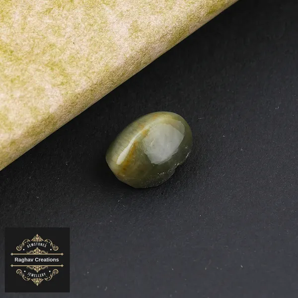 Cat's_eye_Gemstone_weight_-_6.91_Carat_Certificate_Number:-208509
