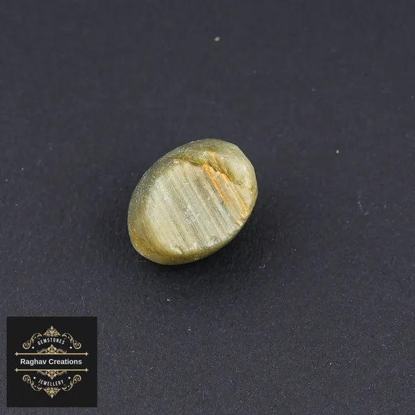 Cat's_eye_Gemstone_weight_-_6.91_Carat_Certificate_Number:-208509