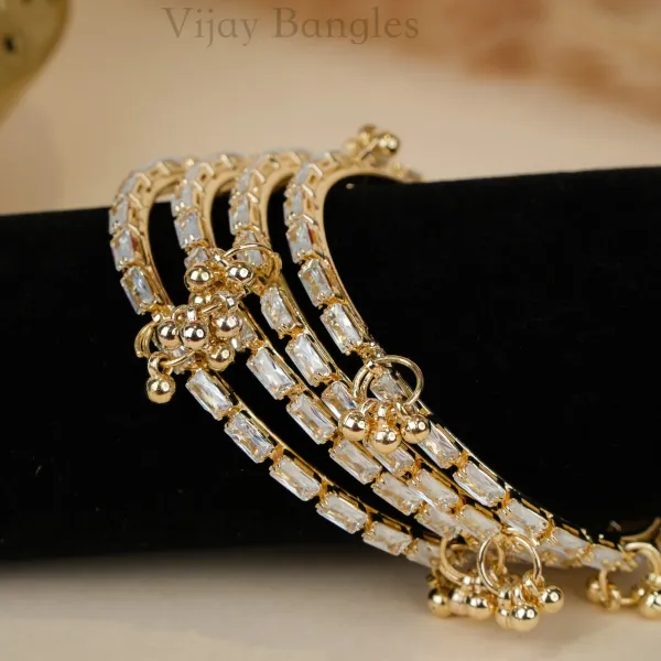 Gold_And_White_Brass_Alloy_Kashmiri_Ad_Stone_Ghungroo_Charm_Bangles_For_Women_Set_Of_4