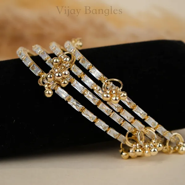 Gold_And_White_Brass_Alloy_Kashmiri_Ad_Stone_Ghungroo_Charm_Bangles_For_Women_Set_Of_4