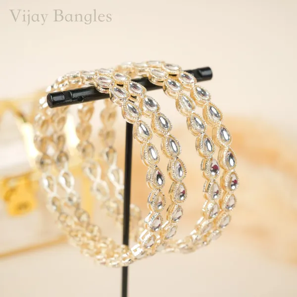 Gold_And_White_Brass_Alloy_Teardrop_Kundan_Festive_Bangles_For_Women_Set_Of_4