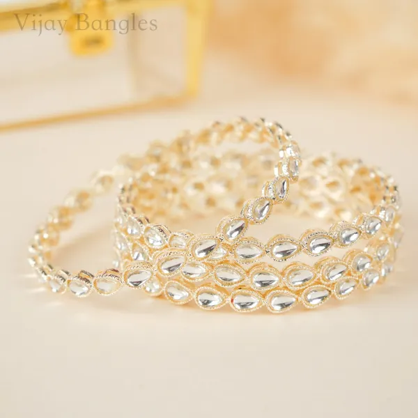 Gold_And_White_Brass_Alloy_Teardrop_Kundan_Festive_Bangles_For_Women_Set_Of_4